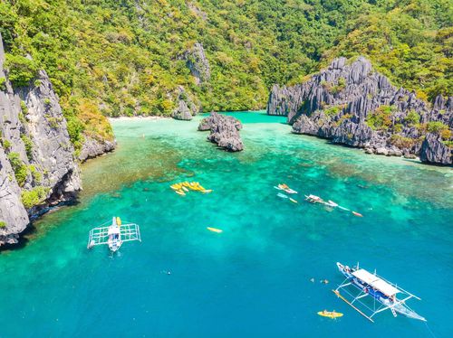 Ubugon Cove on paradise Cadlao island with sharp limestone rocks, tropical travel destination - El Nido, Palawan, Philippines