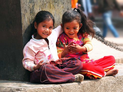Kids sitting on the street of Kathmandu Nepal