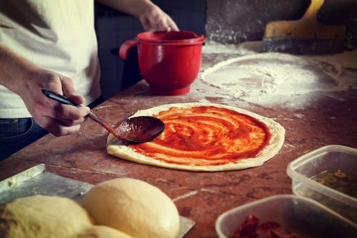 Pizza being prepared in Italy