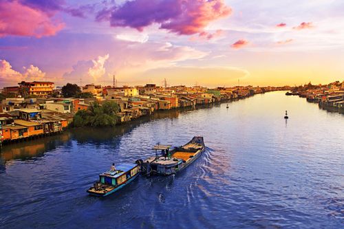 Peaceful sunset on the Mekong river in Viet Nam. This part of the world was quite unpleasant to be in during the Vietnam War, today the calm waters of the Mekong no longer flow red. This is a new era.