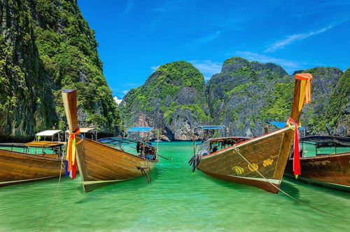 Long tail boats on famous Maya Bay on Phi Phi Islands, Thailand