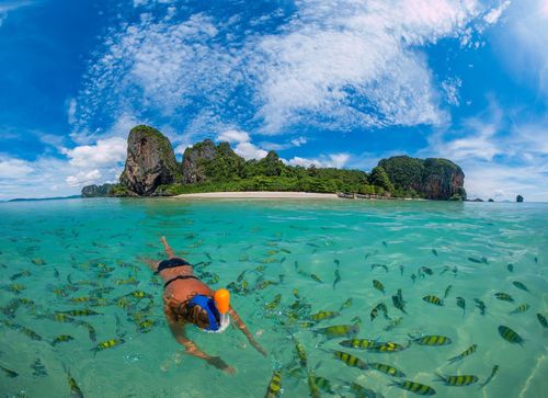 Woman snorkling in Poda Beach in Krabi Thailand