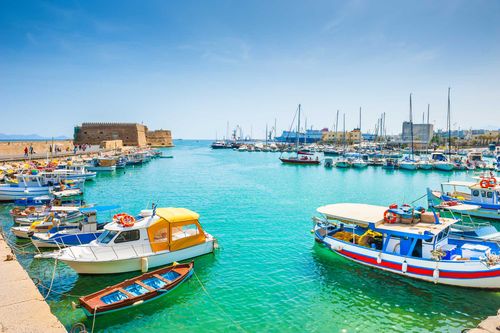 Old venetian harbor with boats in Heraklion, Crete island, Greece