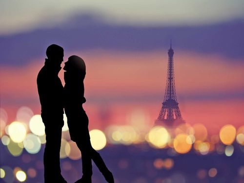 Romantic lovers with eiffel tower on a background in Paris