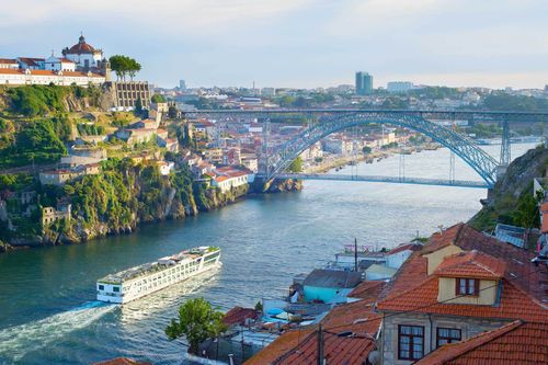 Cruise ship arrives to Porto by the river Douro. Portugal