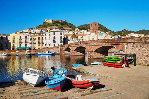 Colorful fishing boats near the river in Bosa, Sardinia