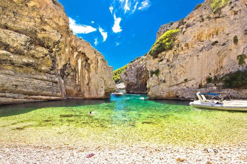 stinva-bay-beach-vis-island-croatia-shutterstock_415285456